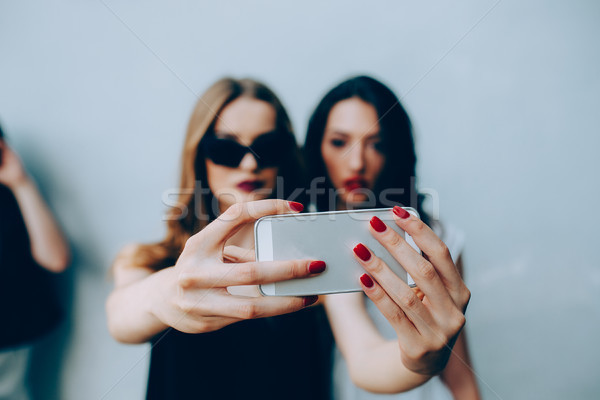 Two girlfriends taking a selfie Stock photo © tekso