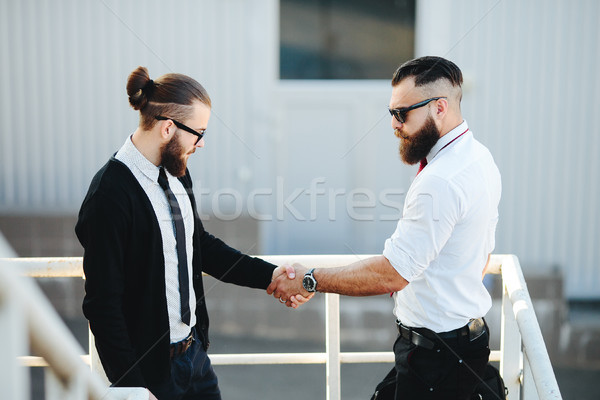 Two businessmen shaking hands Stock photo © tekso