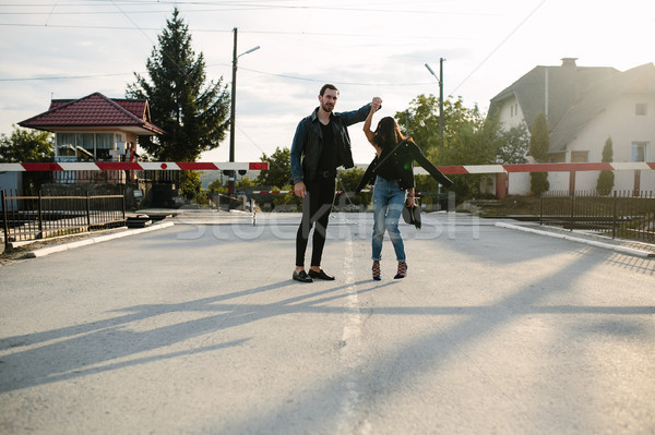 man and woman standing at the railway crossing Stock photo © tekso