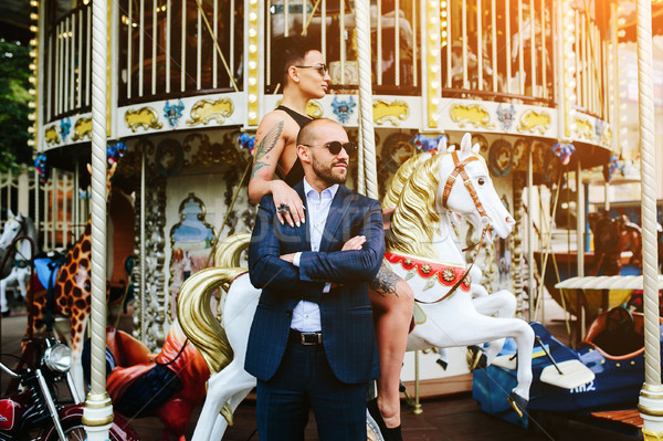 adult man and woman on a carousel Stock photo © tekso