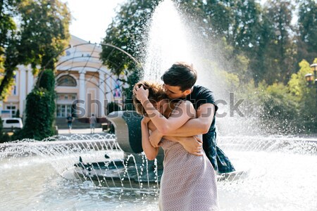 beautiful young couple at the fountain Stock photo © tekso