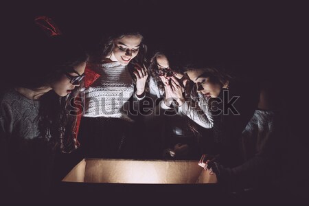 Sisters opens box with a Christmas present Stock photo © tekso