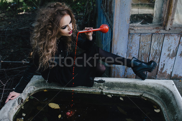 Vintage witch with elixir in hand Stock photo © tekso