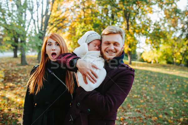 Stock photo: young family and newborn son in autumn park