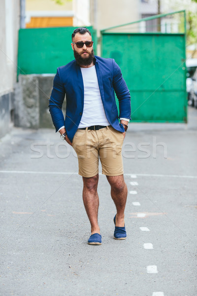 Stylish bearded man walks through the city Stock photo © tekso