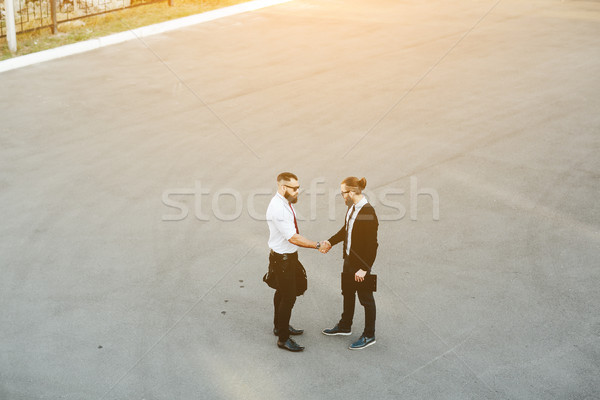 Two businessmen shaking hands Stock photo © tekso