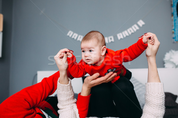 Happy family with newborn baby on the bed Stock photo © tekso