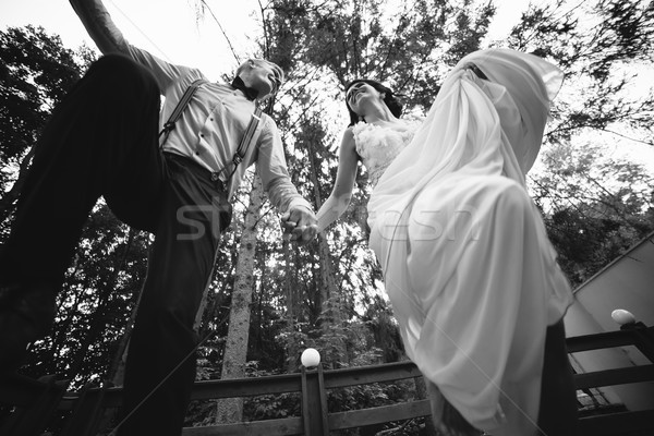 bride and groom jumping, having fun Stock photo © tekso