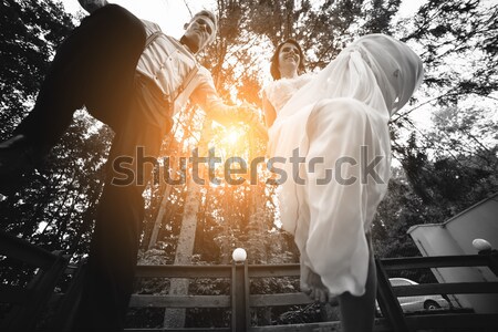 bride and groom jumping, having fun Stock photo © tekso