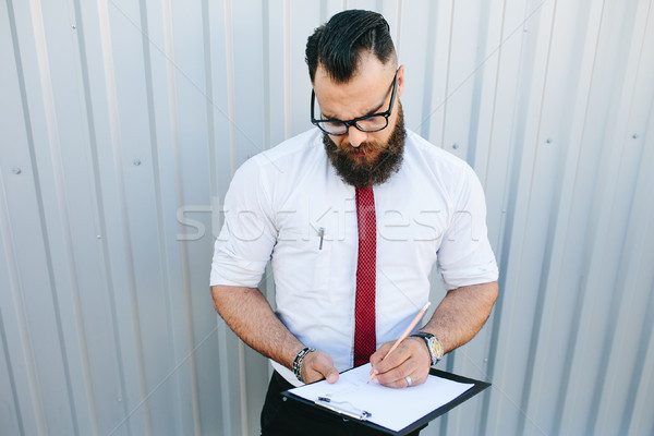 businessman signs a document Stock photo © tekso