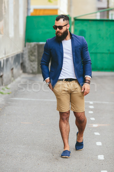 Stylish bearded man walks through the city Stock photo © tekso