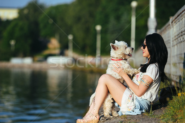 girl with a dog on the lake Stock photo © tekso