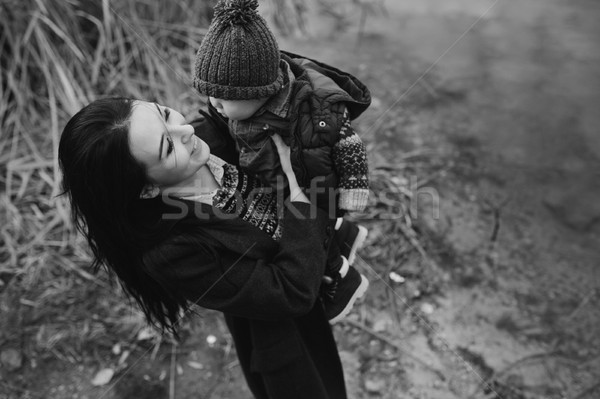 Stock photo: woman and child on the bank of river