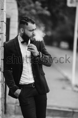 young guy in a suit posing Stock photo © tekso