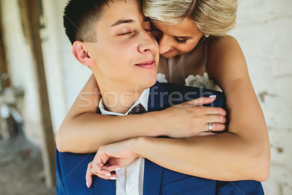 Bride embraces bridegroom Stock photo © tekso