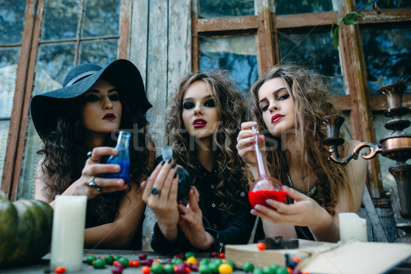 three witches at the table Stock photo © tekso