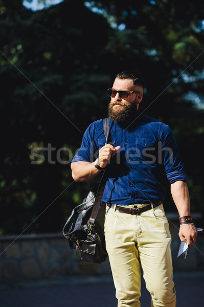 bearded man walks through the city Stock photo © tekso