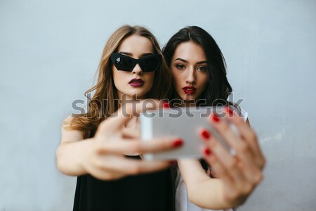 Two girlfriends taking a selfie Stock photo © tekso