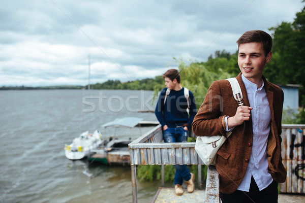 two young guys standing on a pier Stock photo © tekso