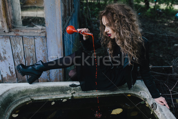 Vintage witch with elixir in hand Stock photo © tekso