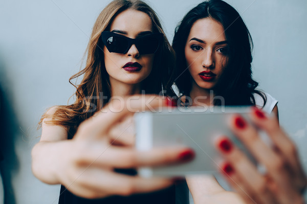 Two girlfriends taking a selfie Stock photo © tekso