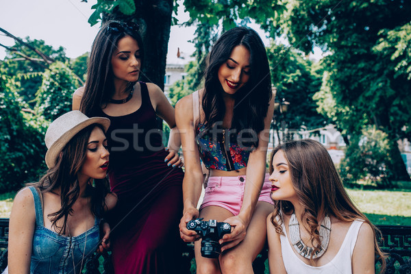 four beautiful young girls consider the camera Stock photo © tekso