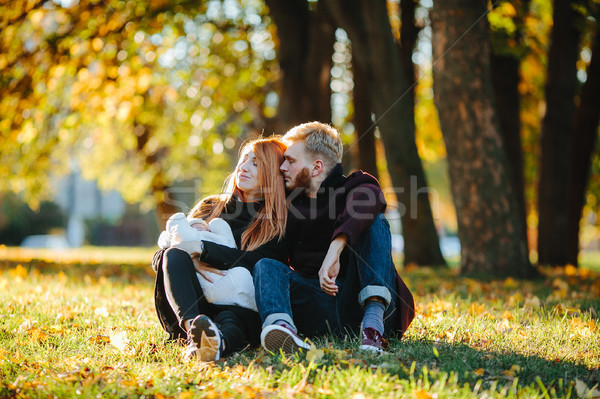 young family and newborn son in autumn park Stock photo © tekso