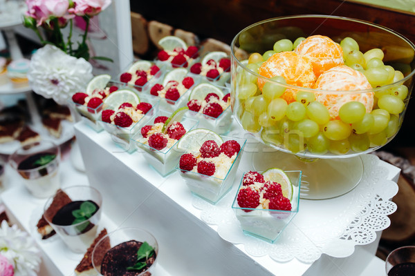 Delicious fancy wedding cake and fruit Stock photo © tekso