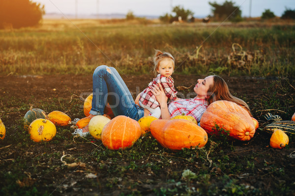 Anya lánygyermek hazugság tökök mező halloween Stock fotó © tekso