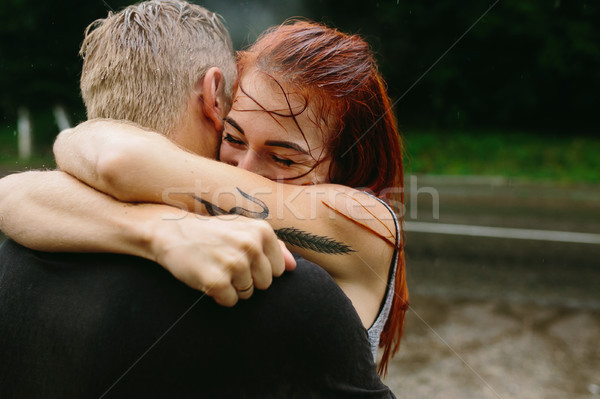 beautiful couple hugging in the rain Stock photo © tekso