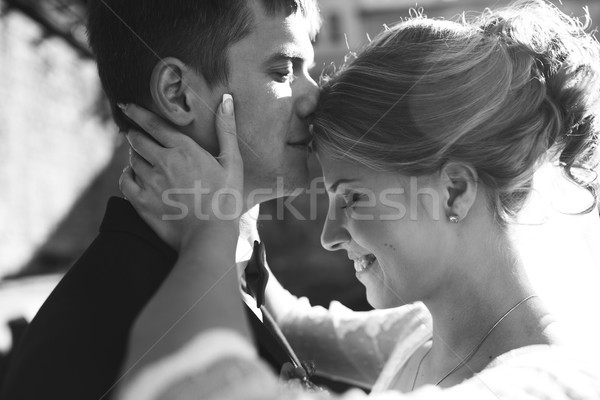 bride and groom posing on the streets Stock photo © tekso