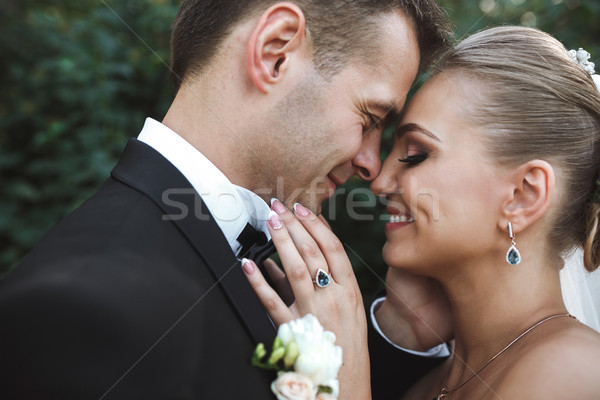 the bride and groom posing together at camera Stock photo © tekso