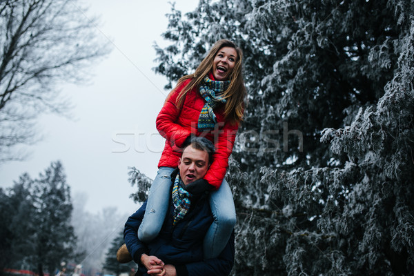 man carries his girlfriend on back Stock photo © tekso