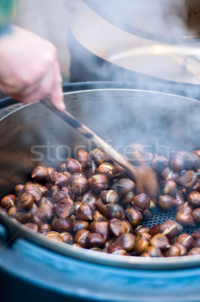 Person makes Roasted Chestnut Stock photo © tepic