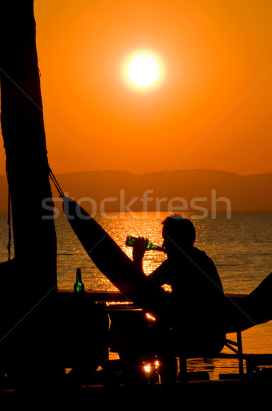 Potable bière coucher du soleil homme plage ciel [[stock_photo]] © tepic