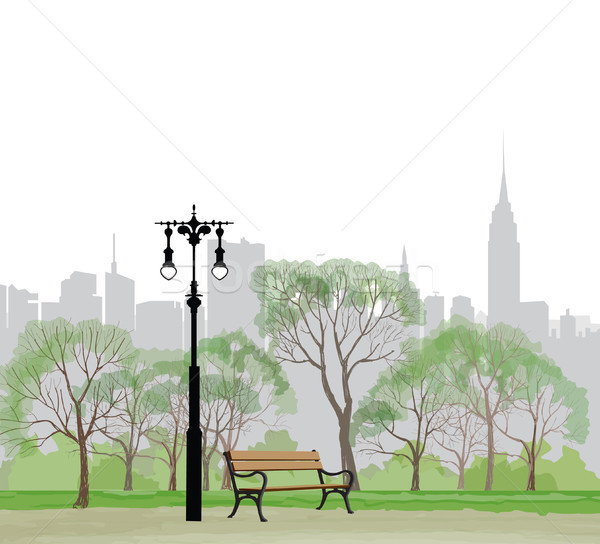 Bench and streetlight in park. City background. Landscape skyline Stock photo © Terriana