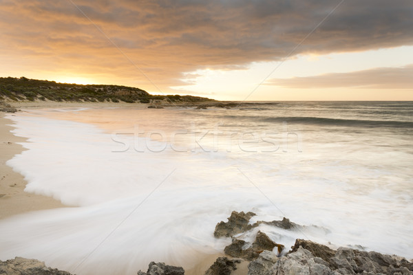 Pôr do sol praia espetacular água areia sol Foto stock © THP