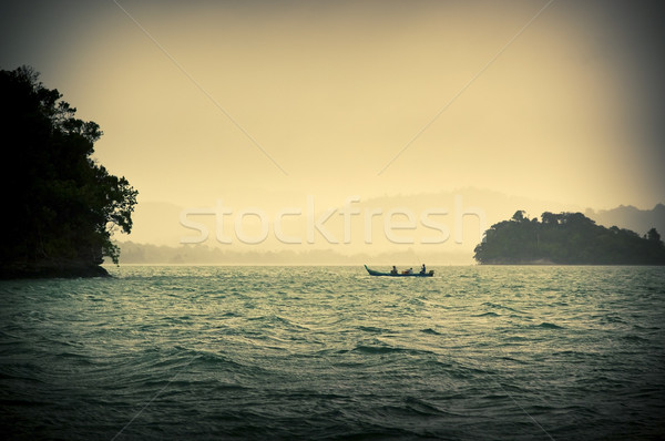 Imagem pessoas pescaria tempestuoso água Foto stock © THP