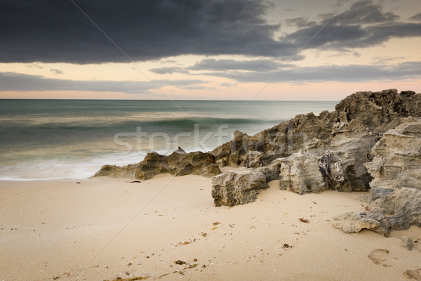 Orageux plage nuages ​​d'orage océan roches sable [[stock_photo]] © THP