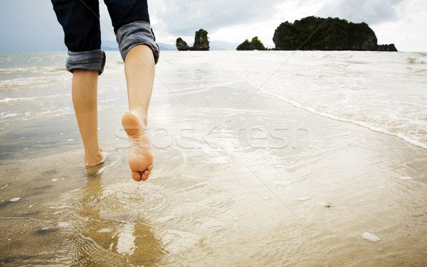 Playa caminando solo mujer agua Foto stock © THP