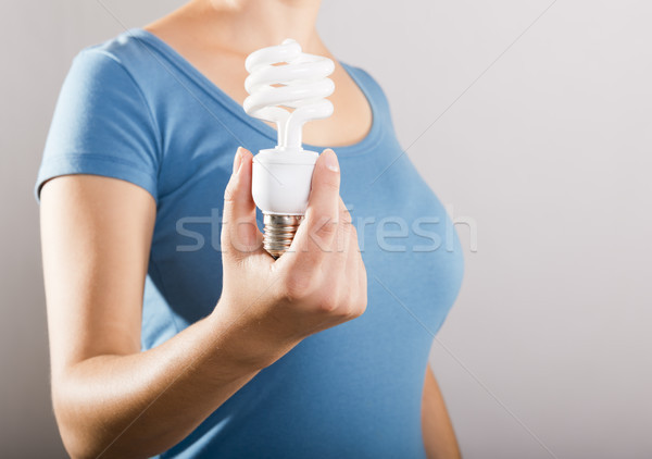 Woman Holding Light Bulb Stock photo © THP