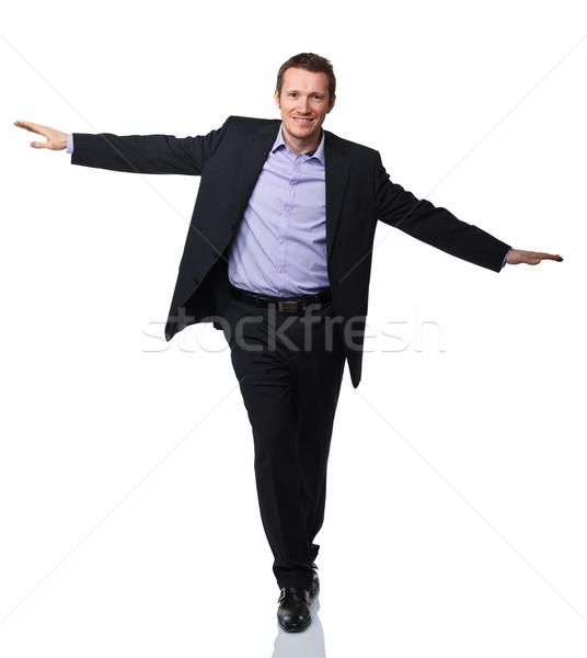 Kiegyensúlyozott férfi üzletember tett ahogy akrobata Stock fotó © tiero