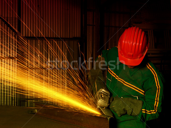 heavy industry manual worker with grinder  Stock photo © tiero