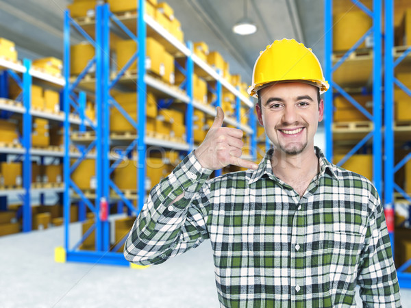 Stock photo: smiling worker in warehouse