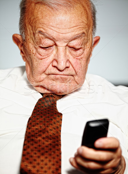 Stock photo: senior use mobile