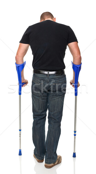 Hombre muleta joven aislado blanco médicos Foto stock © tiero