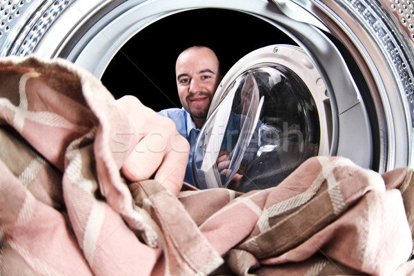 Homme charger machine à laver portrait vue à l'intérieur [[stock_photo]] © tiero