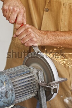 manual worker sharp his tool Stock photo © tiero