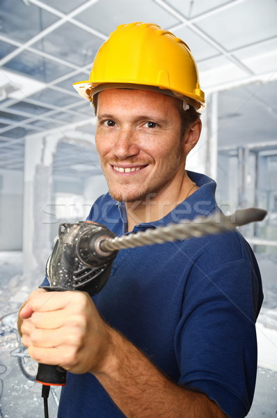 worker with electric drill Stock photo © tiero