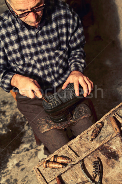 cobbler at work Stock photo © tiero